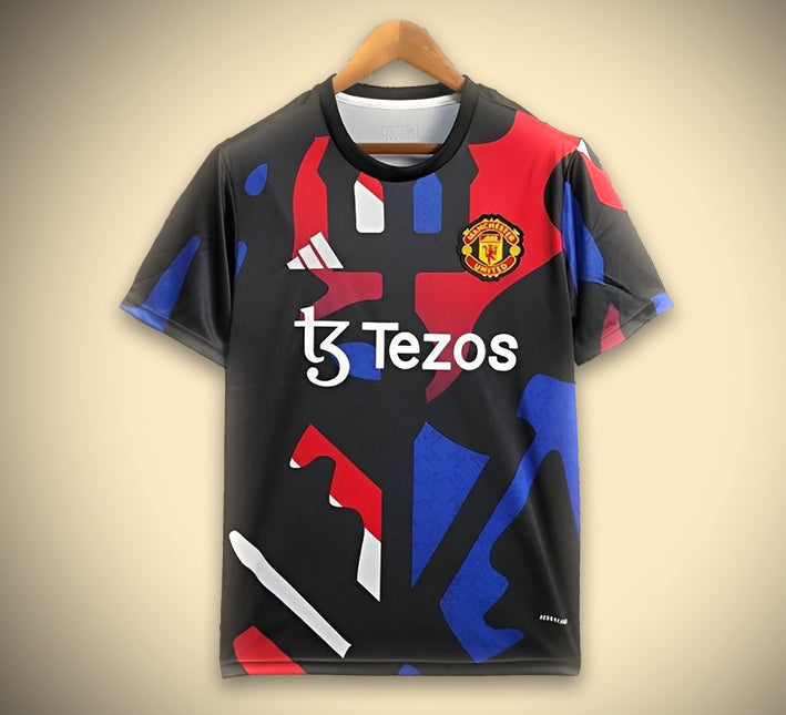 Maillot Manchester noir et rouge et bleu