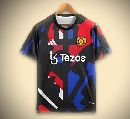 Maillot Manchester noir et rouge et bleu