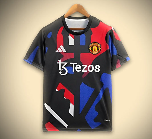 Maillot Manchester noir et rouge et bleu